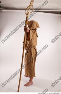 11 2019 01 JOEL ADAMSON MONK STANDING POSE WITH A…